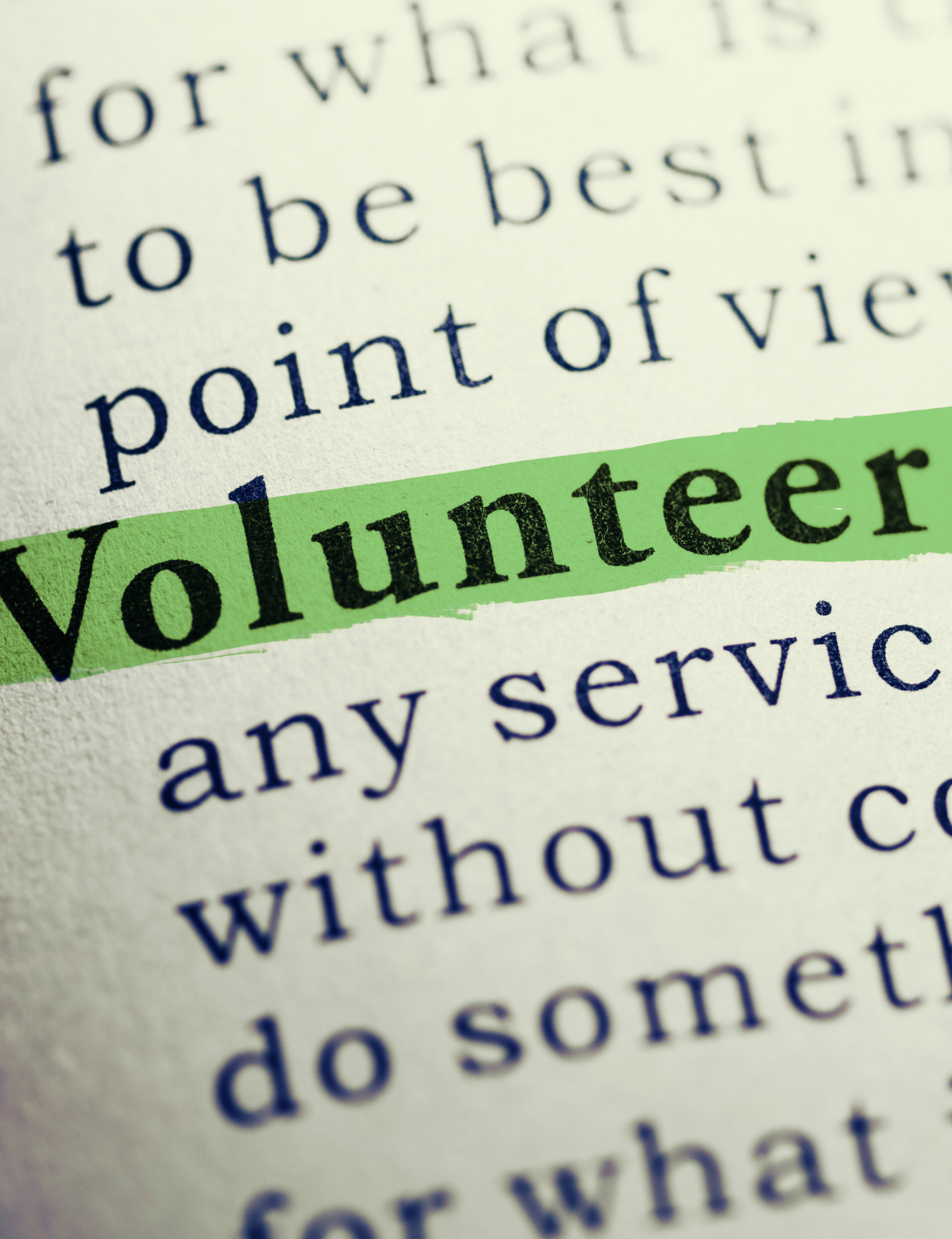 Nahaufnahme eines Textes, das Wort „Volunteer“ ist grün markiert.